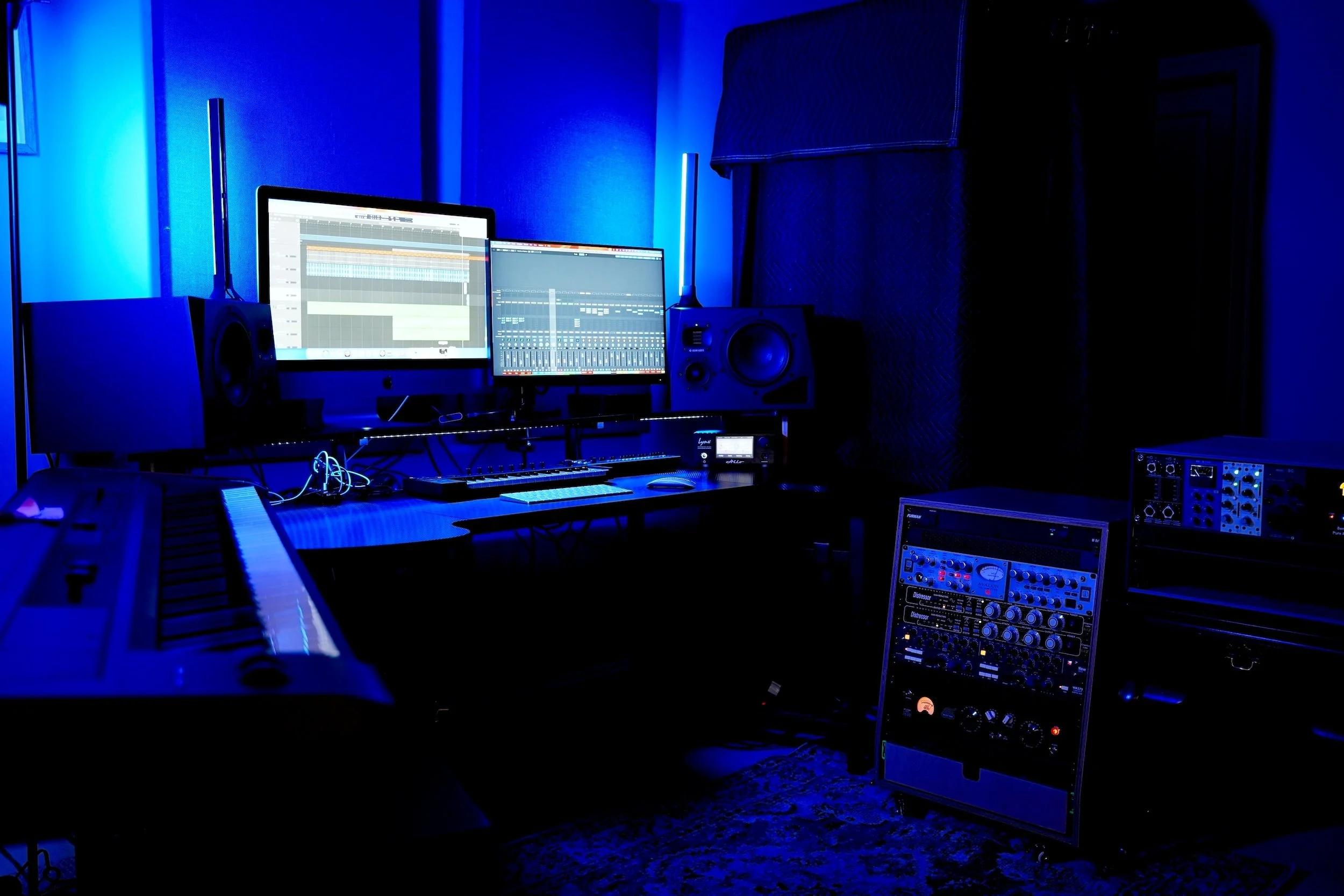professional recording studio with analog gear in blue light daw open Logic Pro