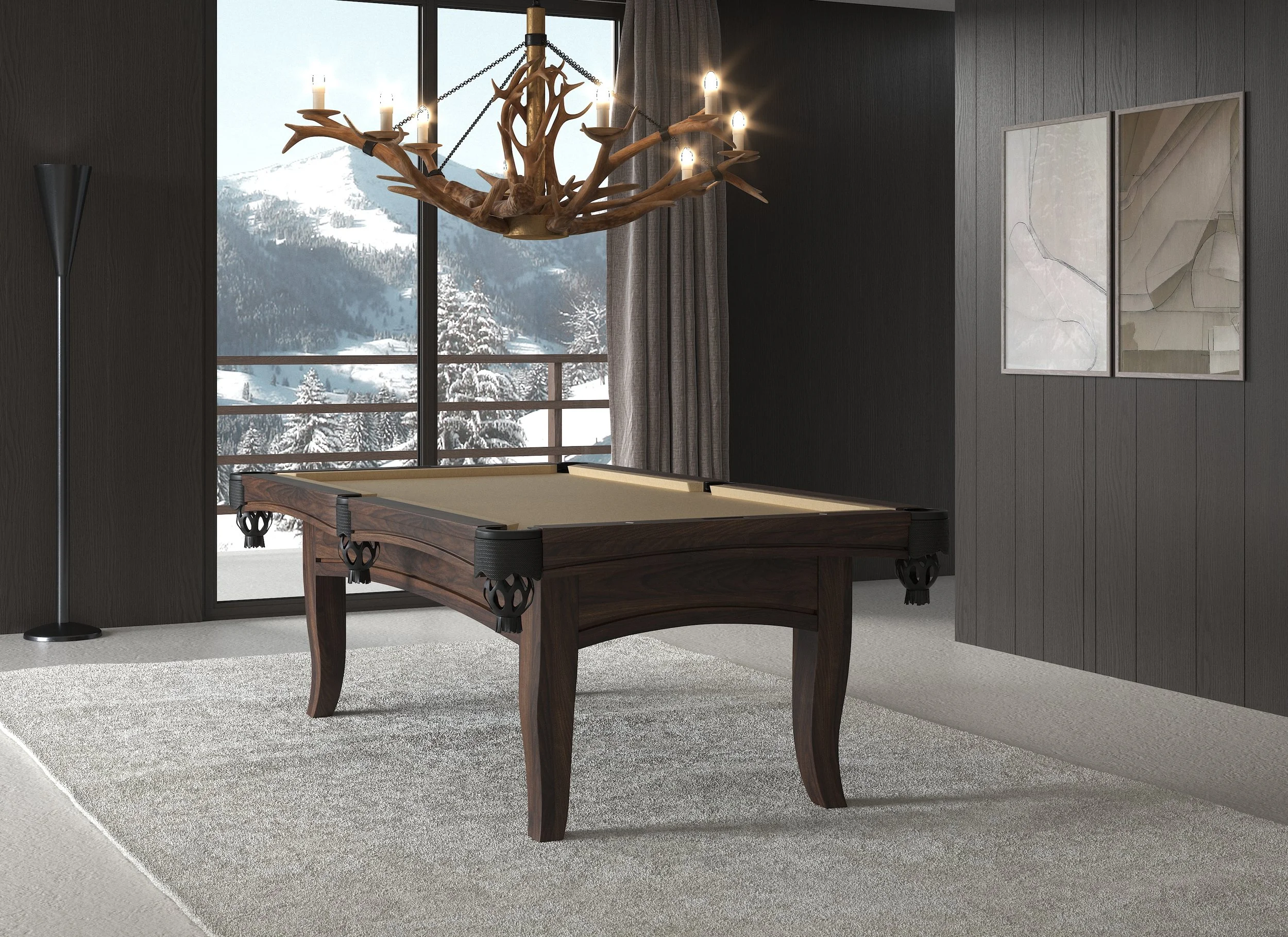 A modern interior room featuring a wooden pool table, large windows with a snowy mountain landscape outside, a chandelier made of antlers with candle-like lights, a floor lamp, gray curtains, and two abstract artwork pieces on the wall.