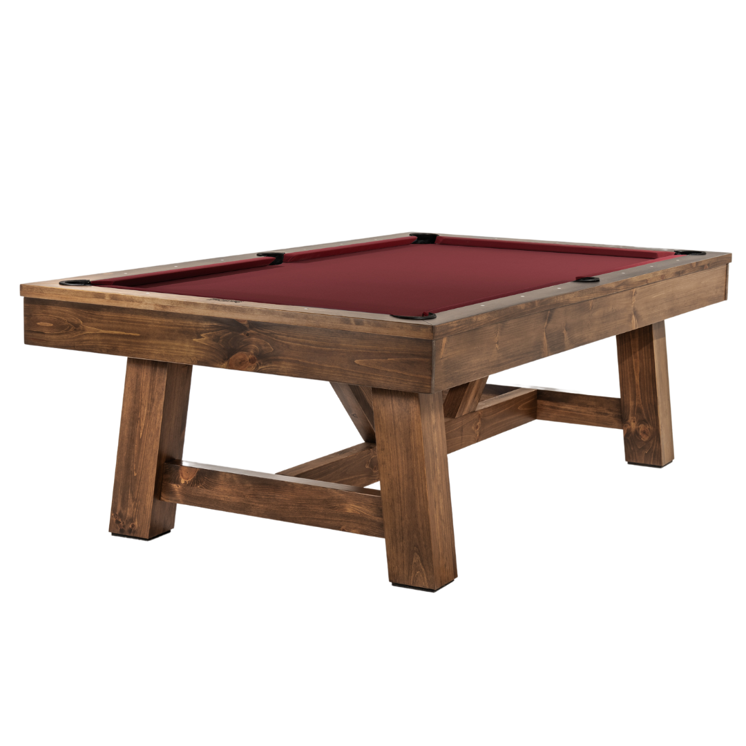 A wooden billiards or snooker table with a red felt surface and black corner pockets.