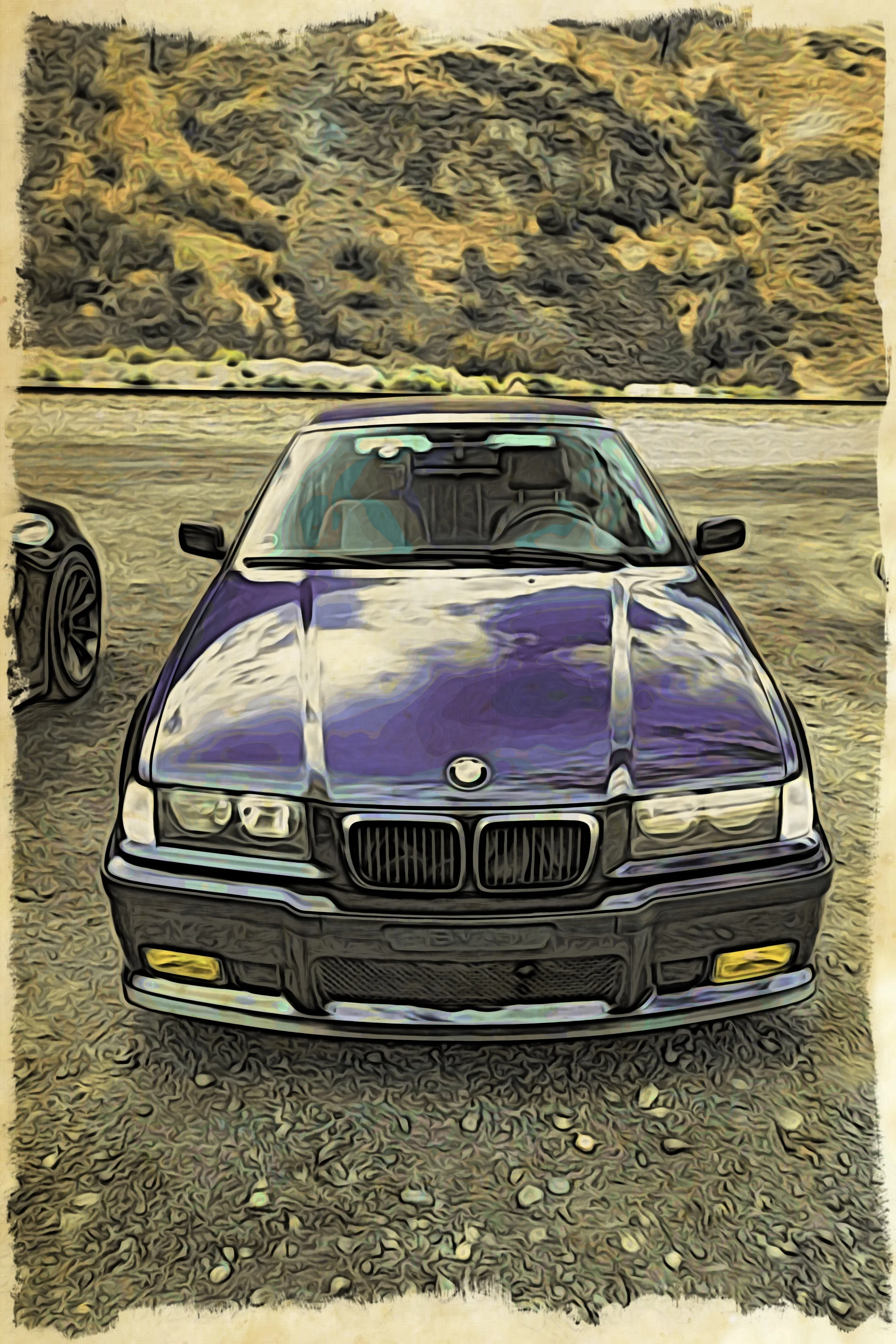 A front view of a black BMW car parked on a gravel area near a body of water with hilly terrain in the background.