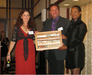 Lovely Lady Products owner Cheryl Caspi (right) receives Center for Resource Conservation's 2012 "Innovator and Entrepreneur of the Year" Award.