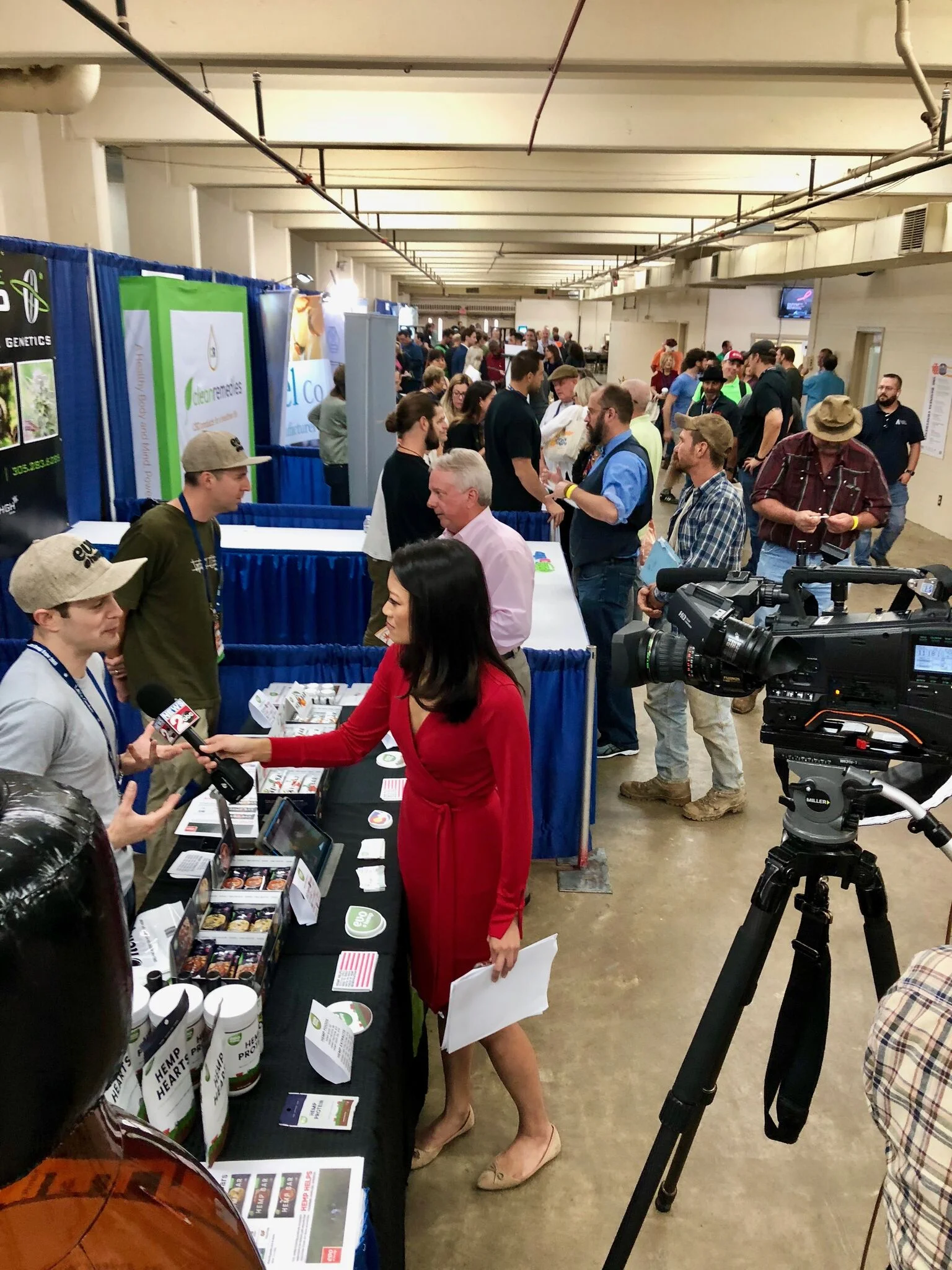 Ari Sherman of Evo Hemp is interviewed by Linda Ong at ABC 2 News in one of the many buzzing exhibition halls.