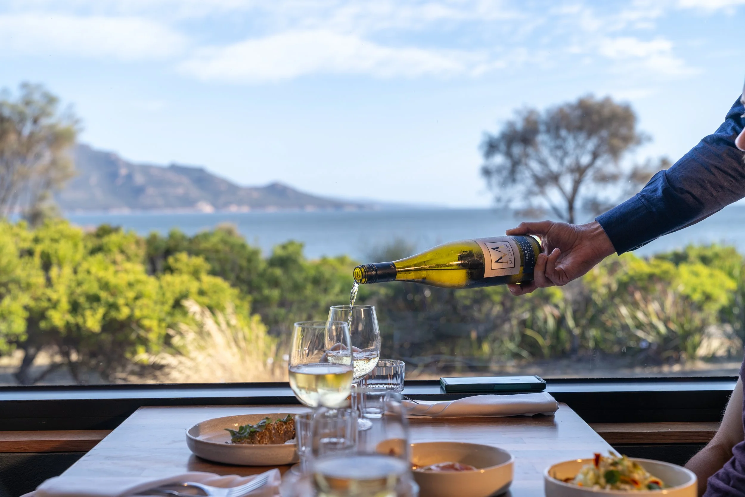 Australia-Tasmania-Edge-of-the-Bay-wine-pouring-restaurant-ocean-view-dining-table-glasses-6166.jpg