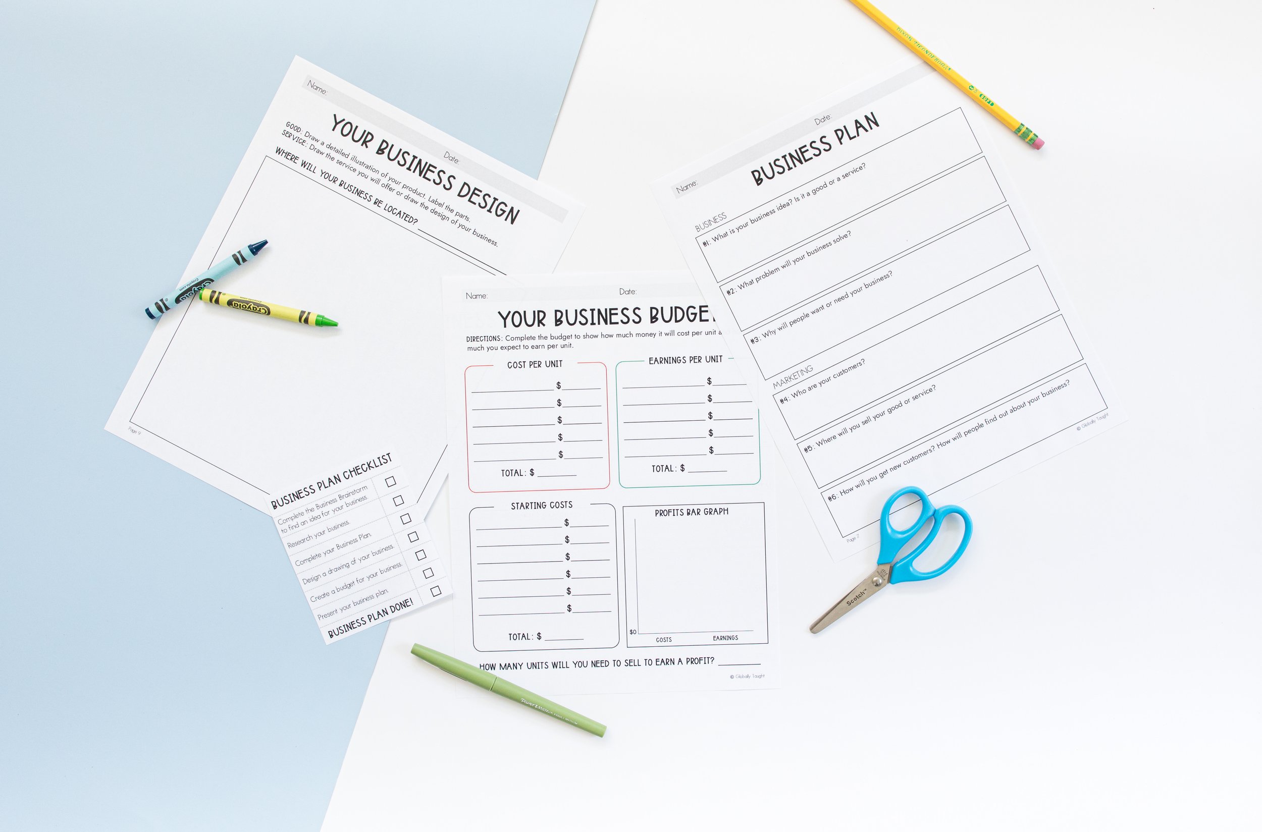 Design a Business Plan Project from Globally Taught's Economics Unit for Kids, with pens and scissors on a light blue surface, including a business plan checklist, budget form, and planning templates.