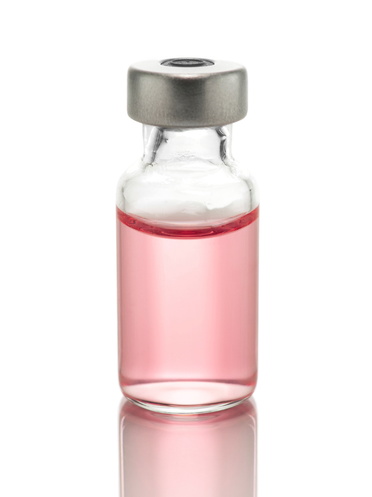 A small glass vial filled with pink liquid, sealed with a metal cap.