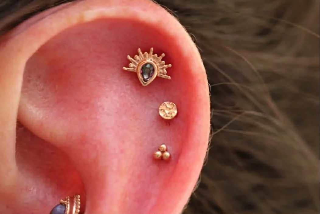 Triple helix with rose gold 
Border line from BVLA Body Vision Los Angeles with Mystic Topaz
3mm hammered disc from Norvoch
Tri-bead from Buddha BVLA