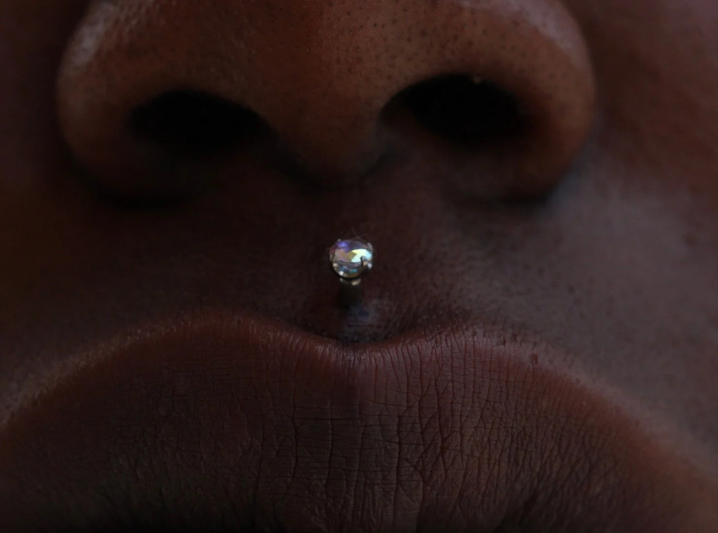 Philtrum piercing and a aurora borealis prong