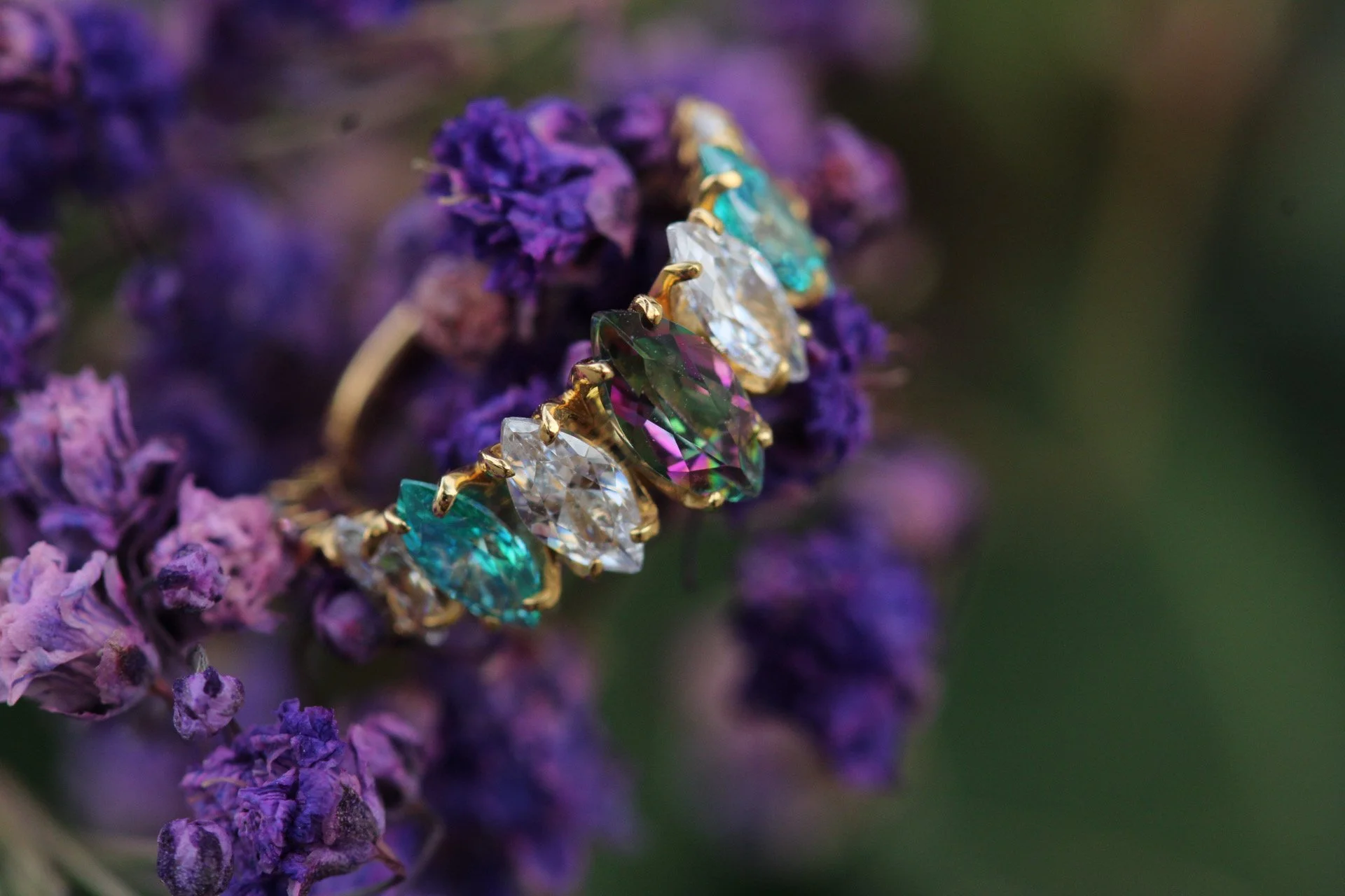 Auris Jewelry 
yellow gold with mystic topaz and cz