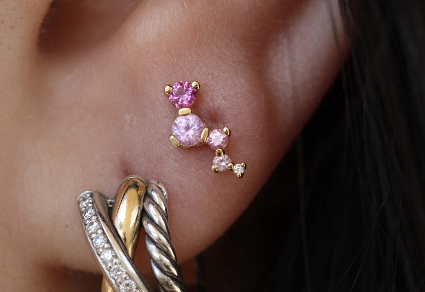 earlobe piercing with a Ripple end from BVLA Body Vision Los Angeles , genuine sapphires , genuine white diamond