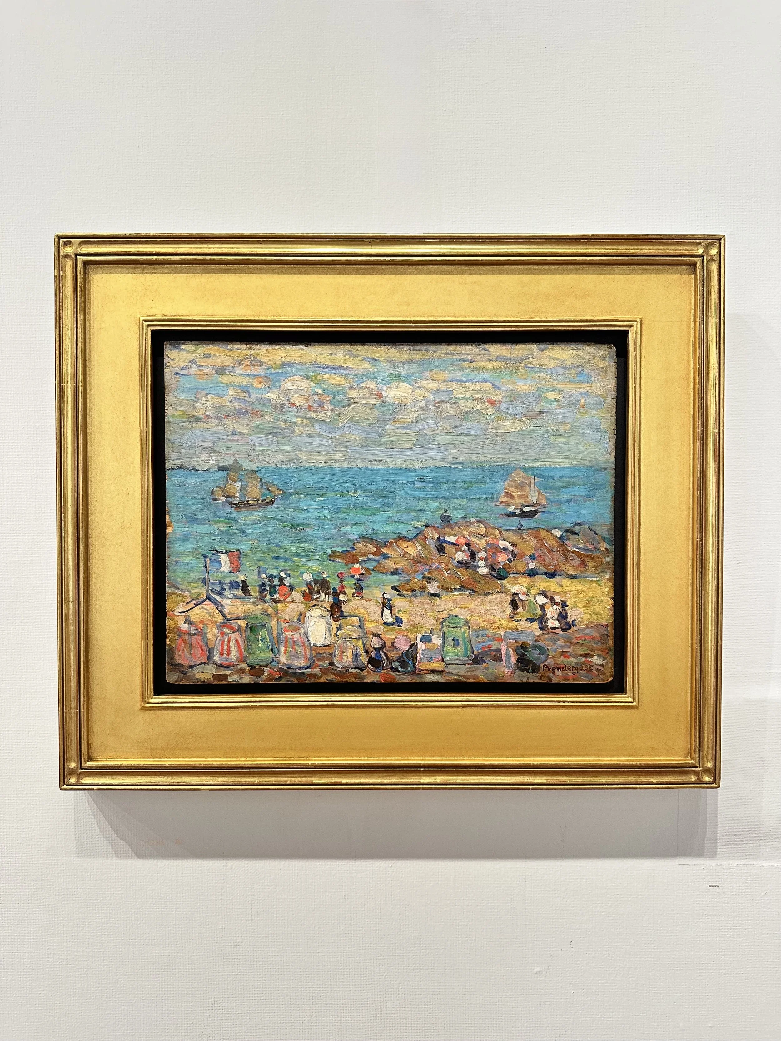 Painting of a beach scene with people, rocks, sailboats, and a cloudy sky, framed with a gold border.