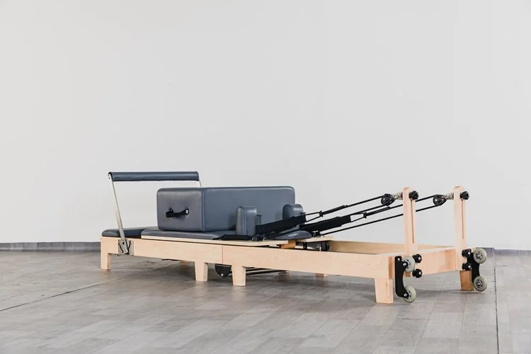 Folding oak reformer pilates machine