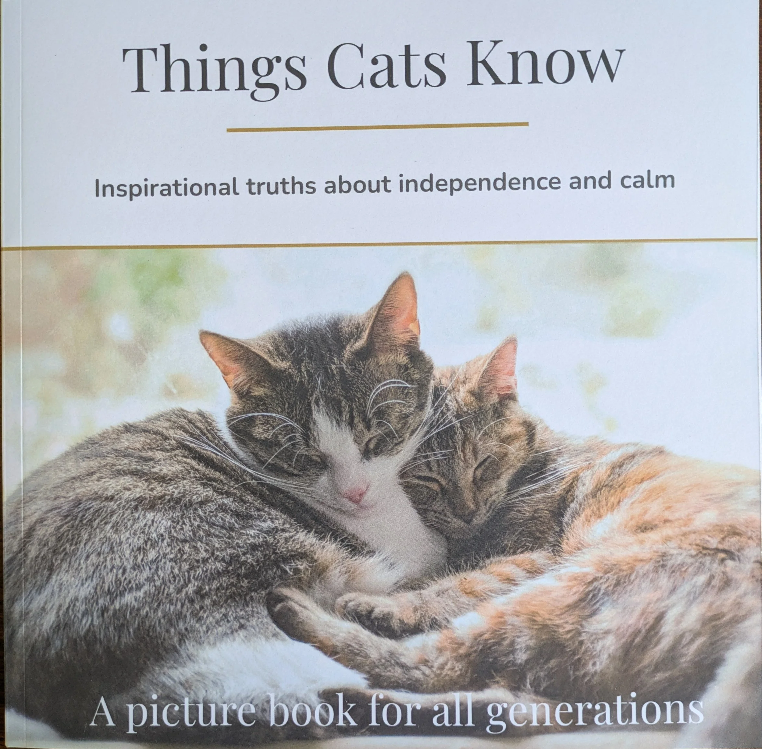 cute cats snuggling on cover of book called 'Things Cats Know'
