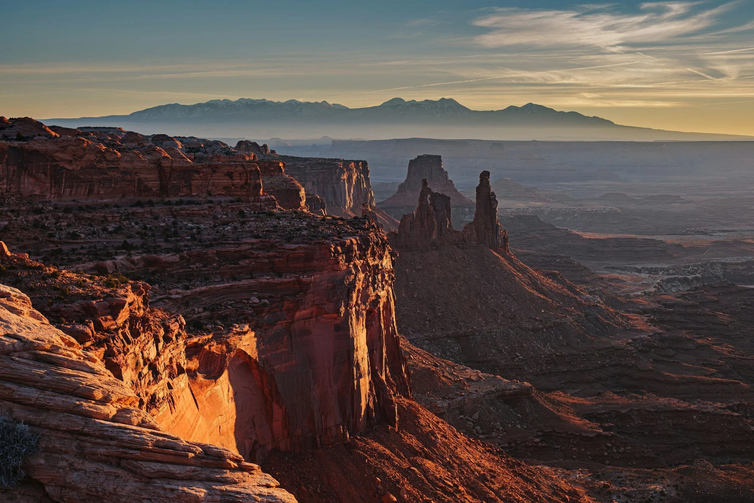 Washerwoman Arch and the La Sal Mountains at sunset - Island in the Sky, Canyonlands National Park