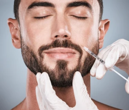 Man receiving a facial injection from a healthcare professional wearing gloves.