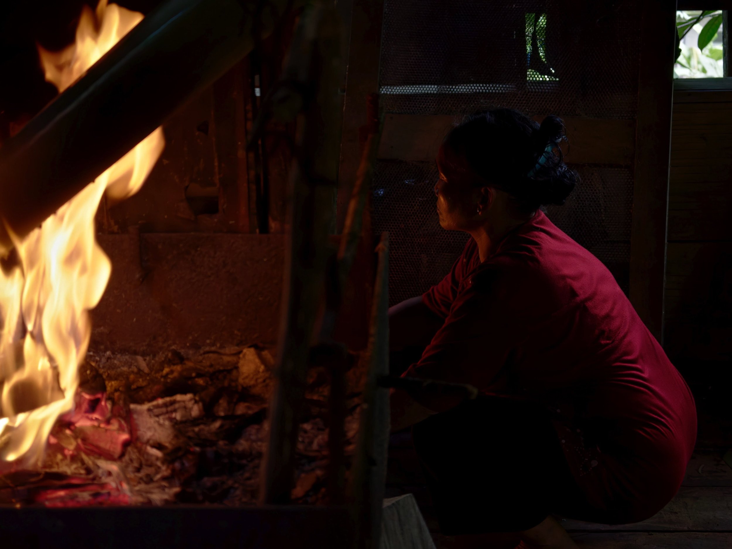 Saie prepping fire to have rice cooked directly in a bamboo tube, no meat, just the rice picking up the smoke and bamboo aroma from the fire. It was so yummy!