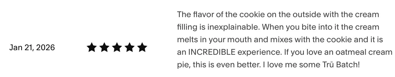 A five-star review with the date January 21, 2026, and descriptive text about the flavor of a cookie filled with cream, emphasizing the delightful experience and love for Trü Batch oatmeal cream pie.