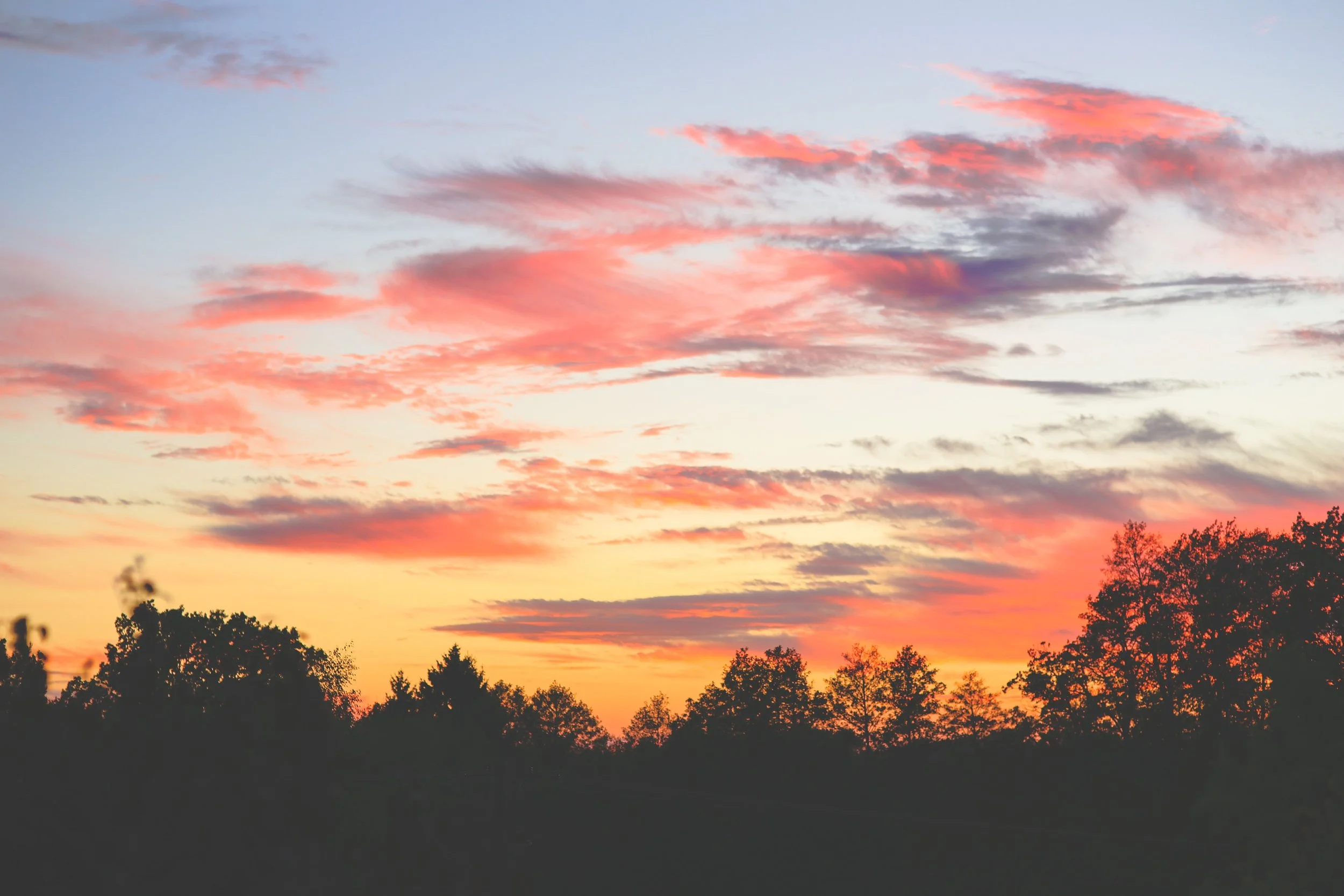 Colorful sunset sky representing emotional healing, acceptance, and finding peace after trauma without needing closure from another person.
