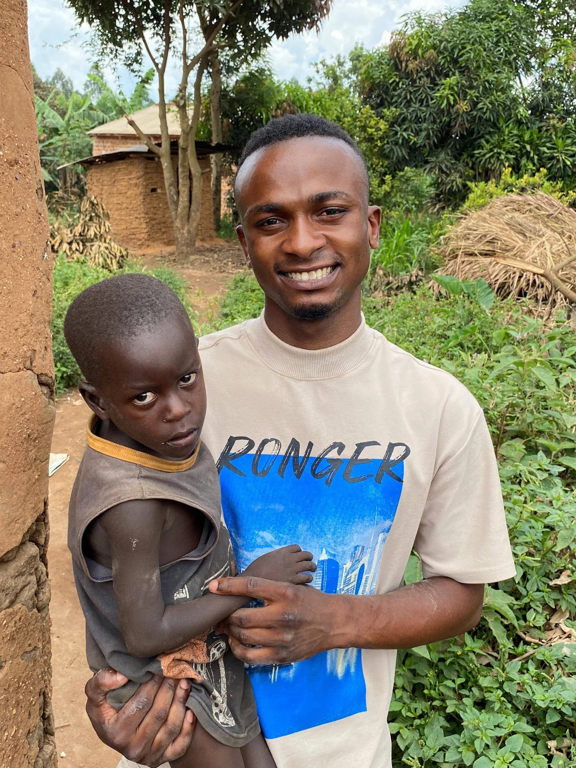 a sideway wide angle photo shot of six Ugandan boys