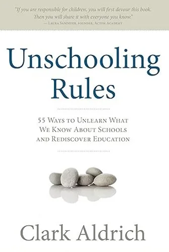 Cover of the book titled 'Unschooling Rules' by Clark Aldrich, featuring a stack of smooth, gray stones.