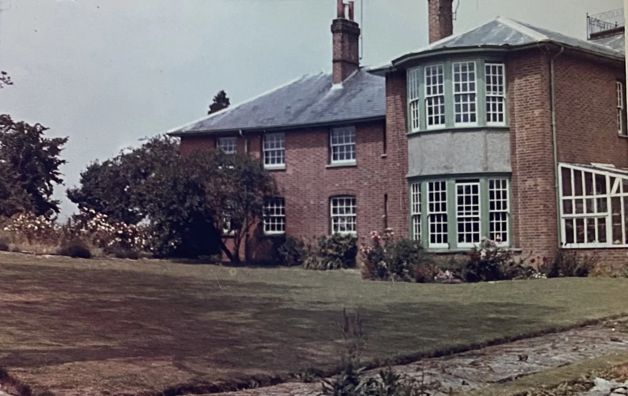 This is Haydon Hill House, a large 8-bedroom house that stood where Alderson Close is today (by Intalbury Avenue). 
Julia said "These pictures are of Haydon Hill House, which was demolished (from memory) in the early 1980s. Once a grand old house, it