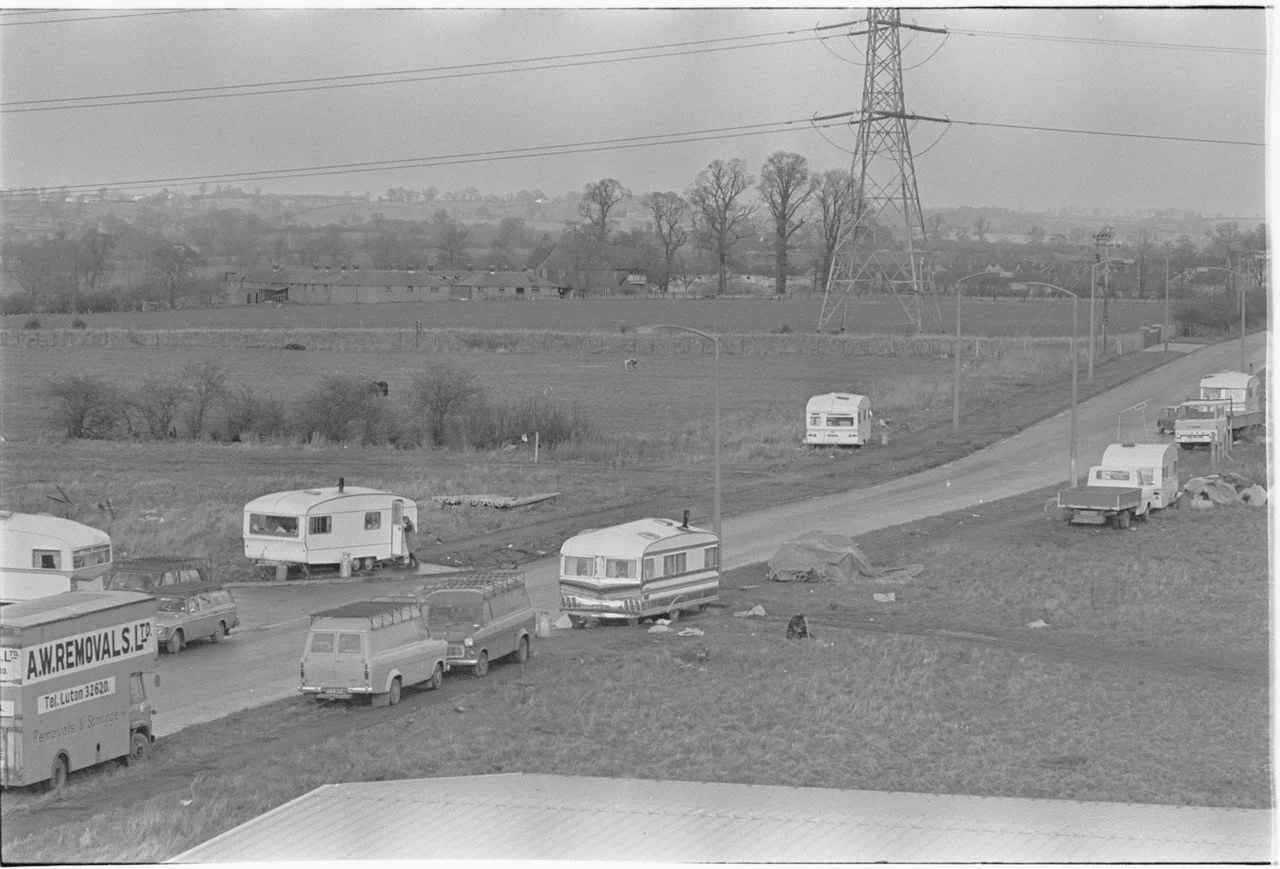 Taken in Feb 1975. Rabans Lane when it was overrun with caravans. The buildings in the foreground are where Sterling Thermal Technology is today. CBS, Faraday Road and Haydon Hill had yet to be built. 
Photo Credit: The Bucks Herald