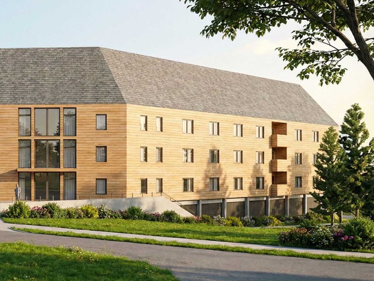 A multi-story wooden residential building with multiple windows and small balconies, surrounded by green grass, trees, and landscaped bushes under a clear sky.