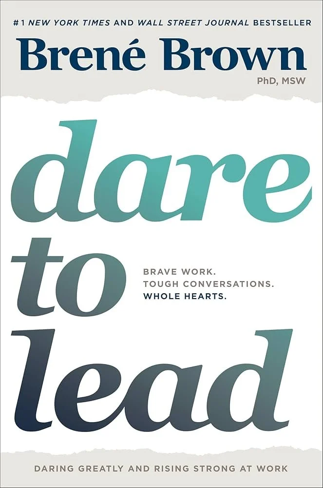 Book cover titled "Dare to Lead" by Brené Brown with subtitle and praise, featuring large teal and black text on a white background.