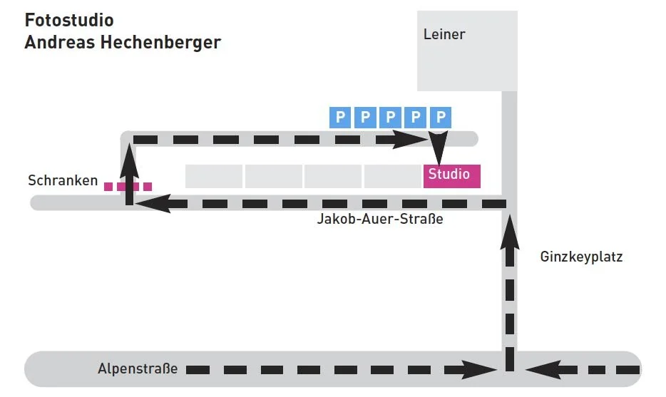 Map layout of a photo studio area showing parking spaces, a studio marked in pink, streets, and surrounding landmarks.