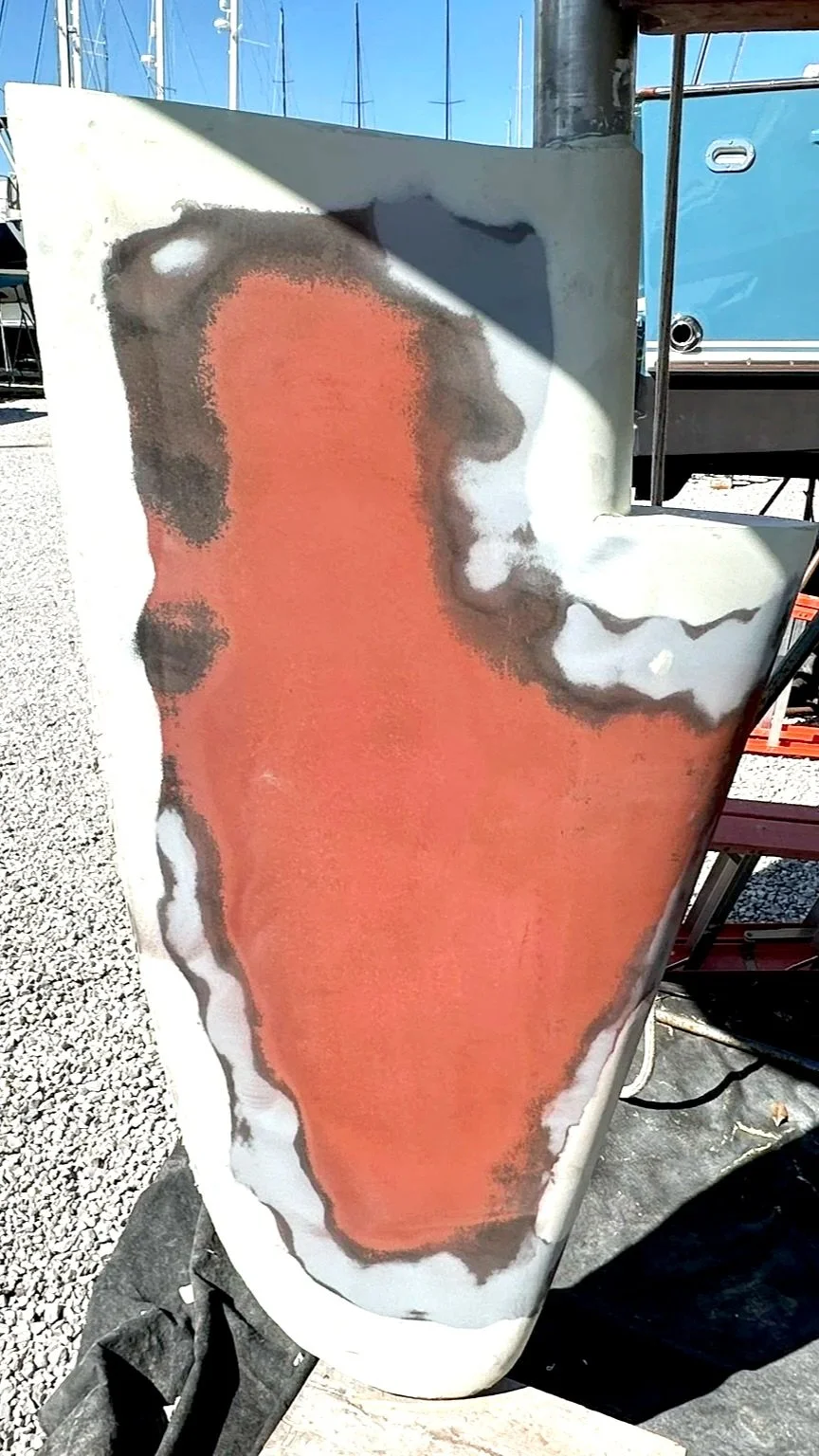 Fiberglass repair, fairing, and refinishing.