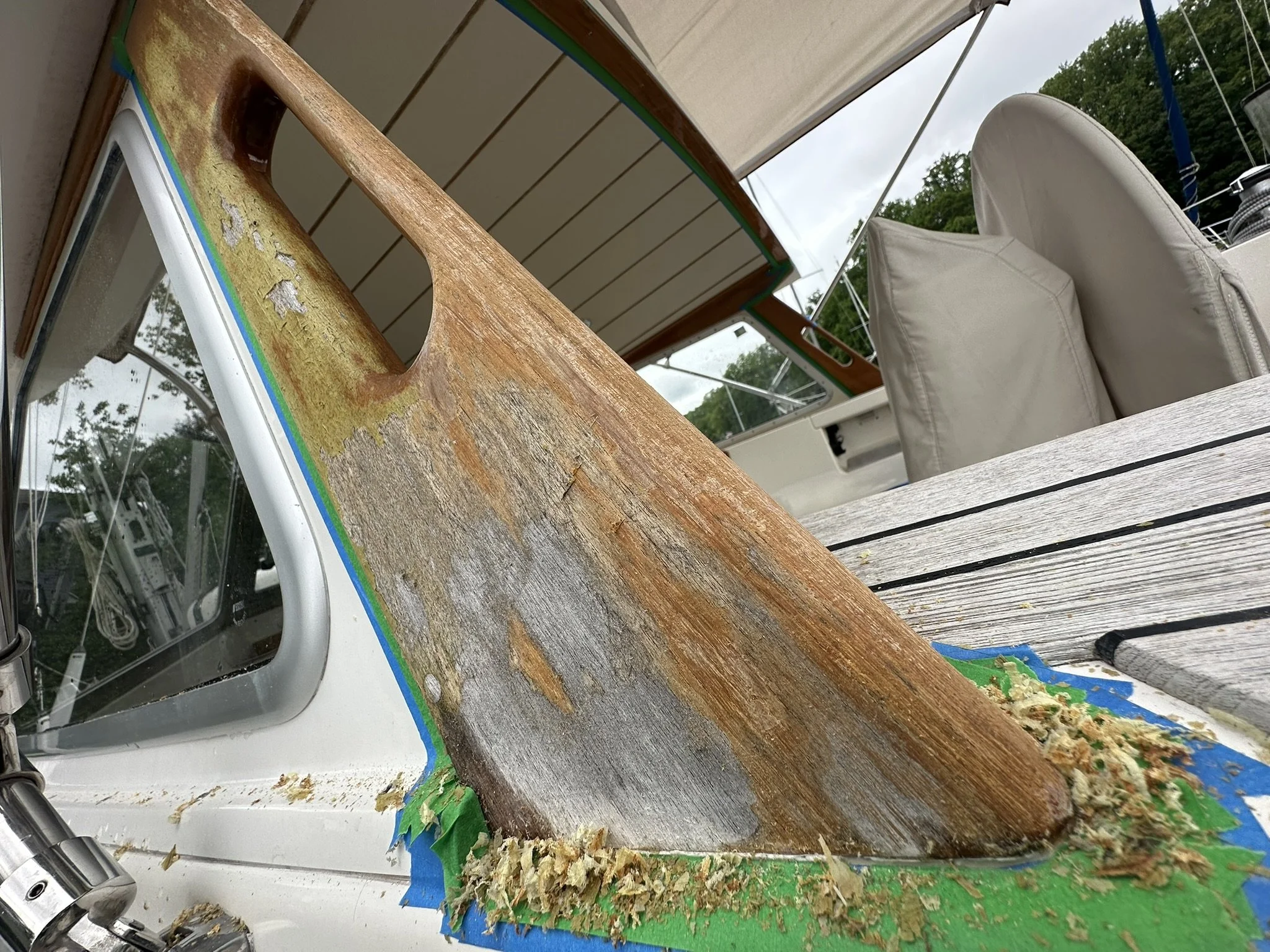 Teak refinishing, hand scraping, and varnish.