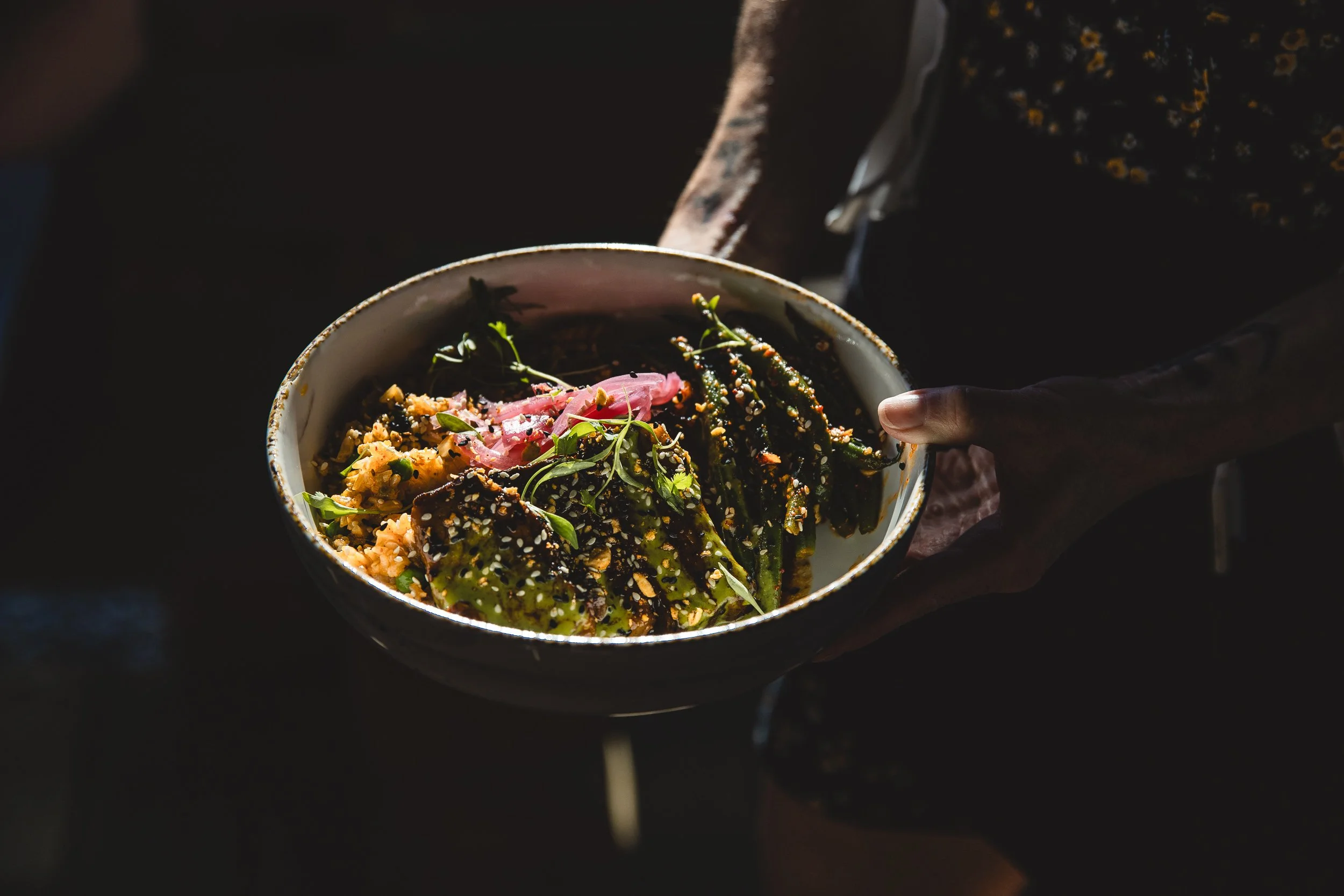 Lifestyle photo of a bowl of fresh food from Sawtooth Hotel during a branding photoshoot in Stanley Idaho.