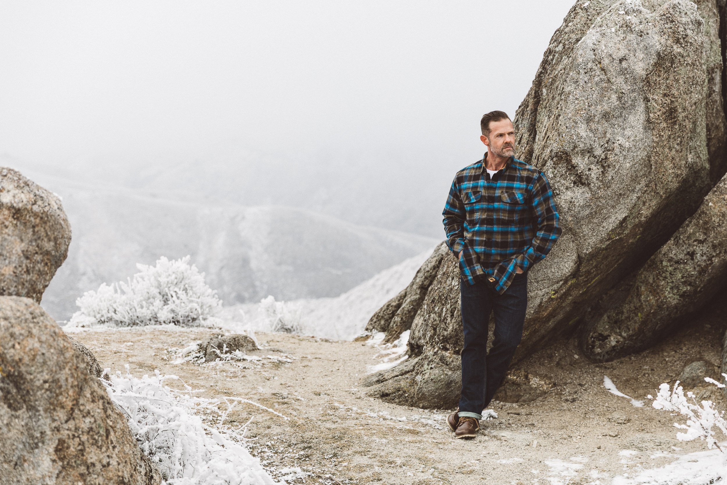 Boise branding photographer capturing authentic outdoor branding photos for a male entrepreneur in the Boise foothills on a foggy day.