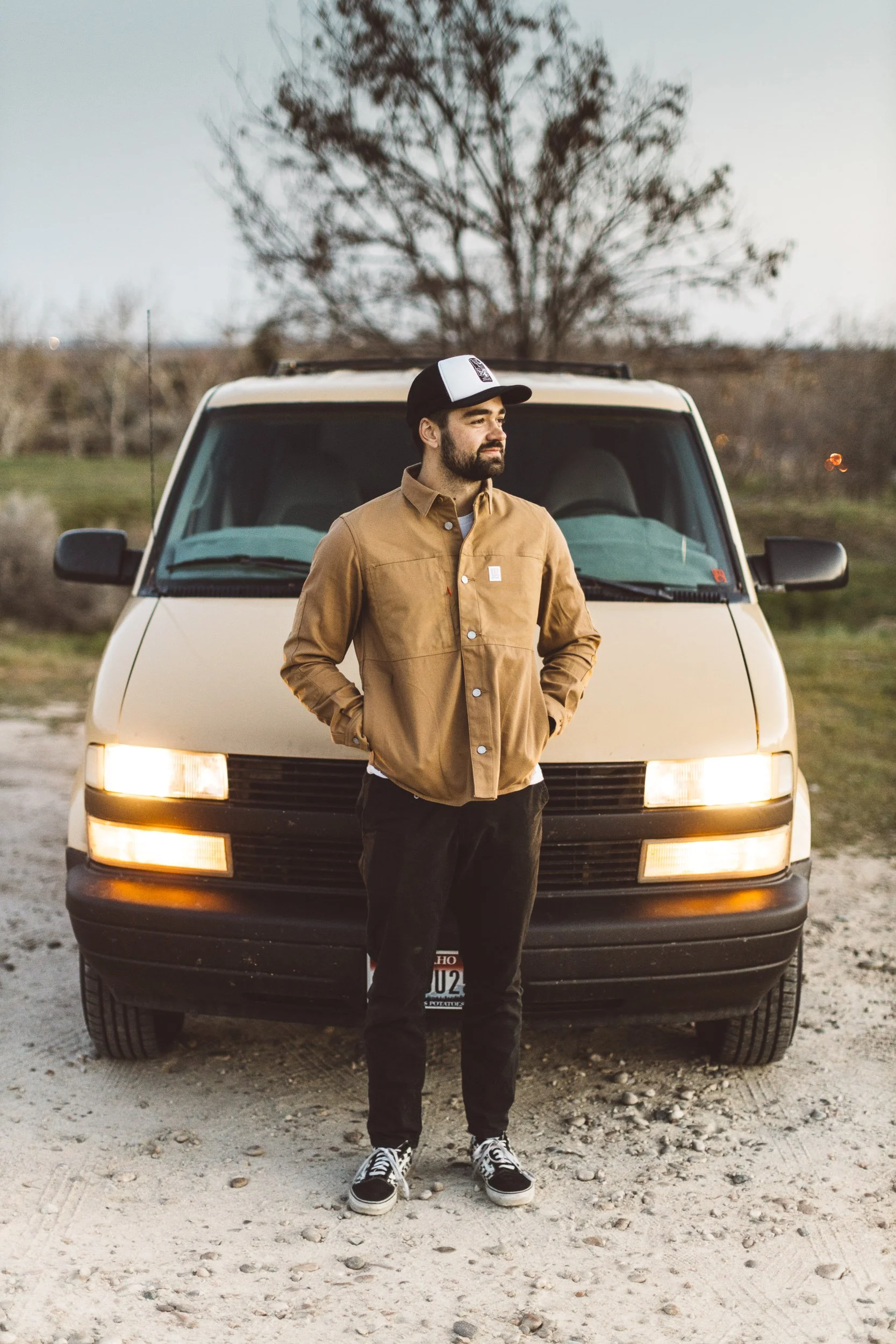boise creative entrepreneur standing in front of his van during a branding photography session in the Foothills in Boise, Idaho