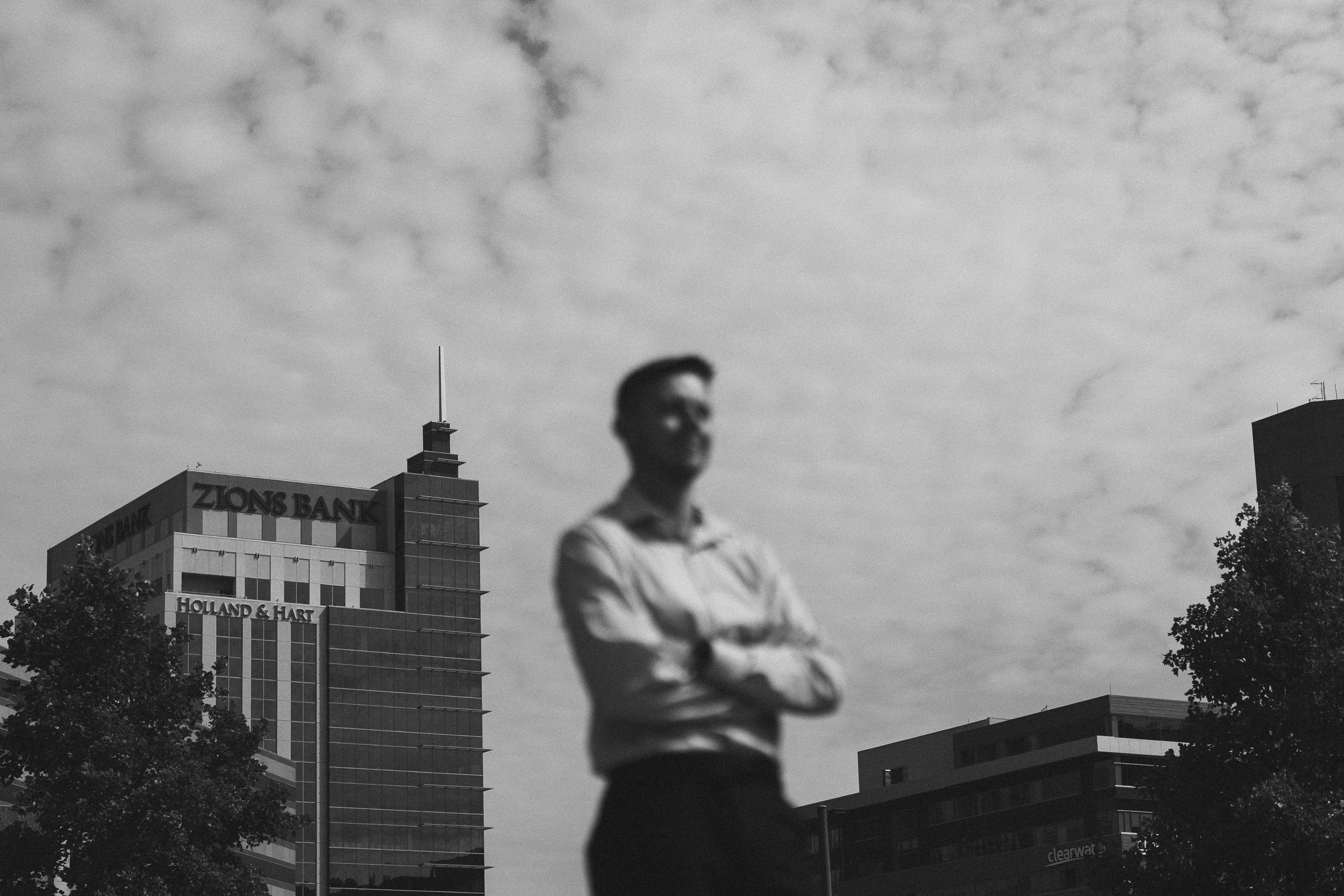 High-energy personal branding photography at Jump Boise featuring a Boise entrepreneur with downtown in the background during a full-day branding photoshoot