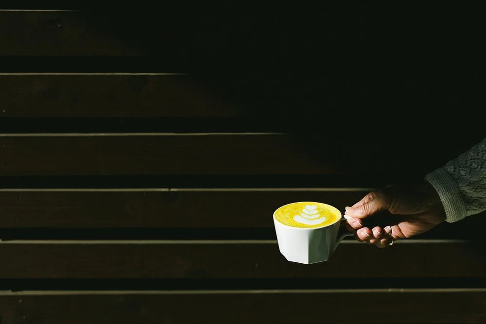 Lifestyle product photo of a turmeric latte taken outdoors in boise, idaho.