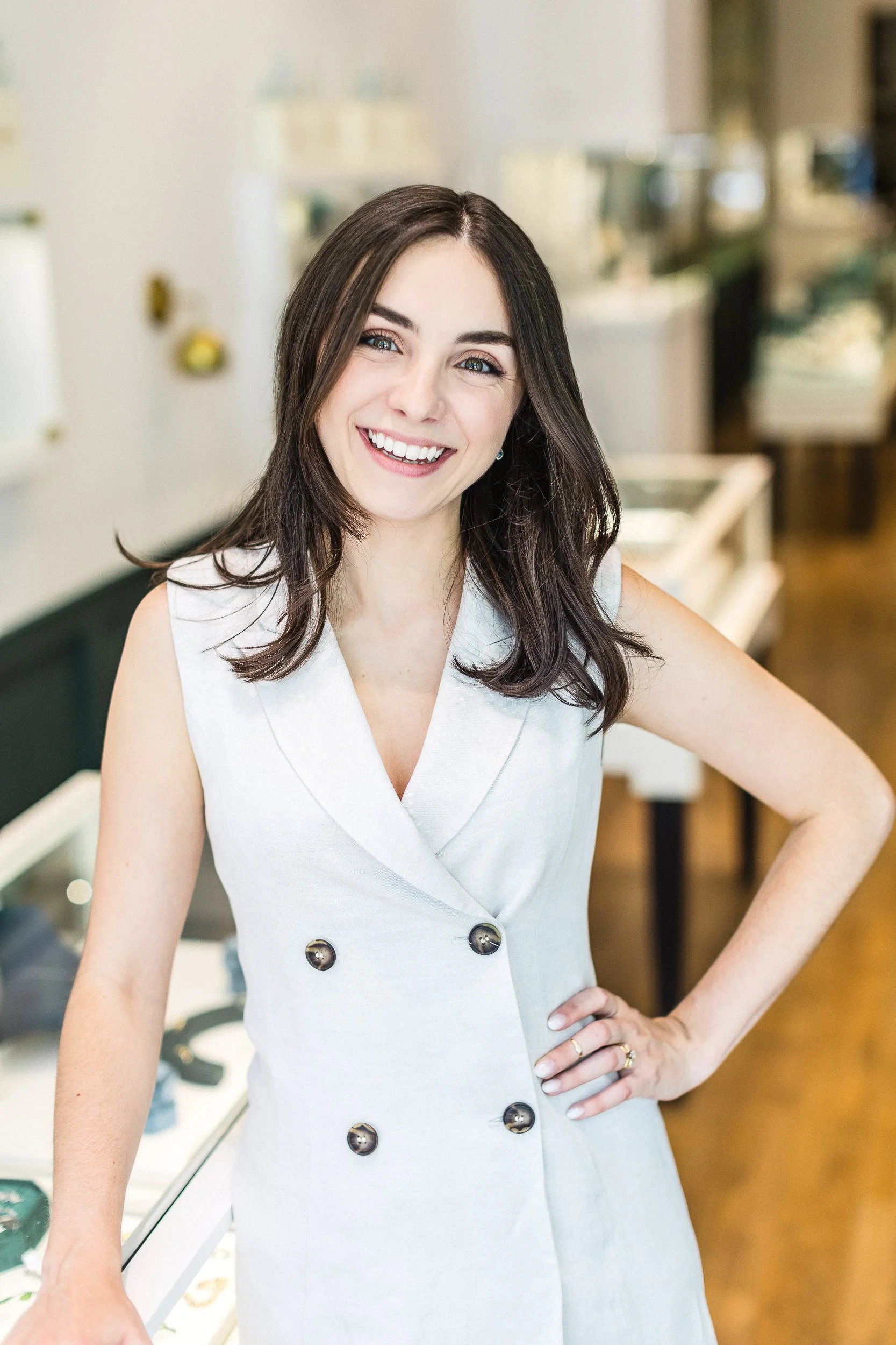 Lifestyle branding photo of a business owner smiling in a custom jewelry shop during a branding photoshoot in downtown Boise.
