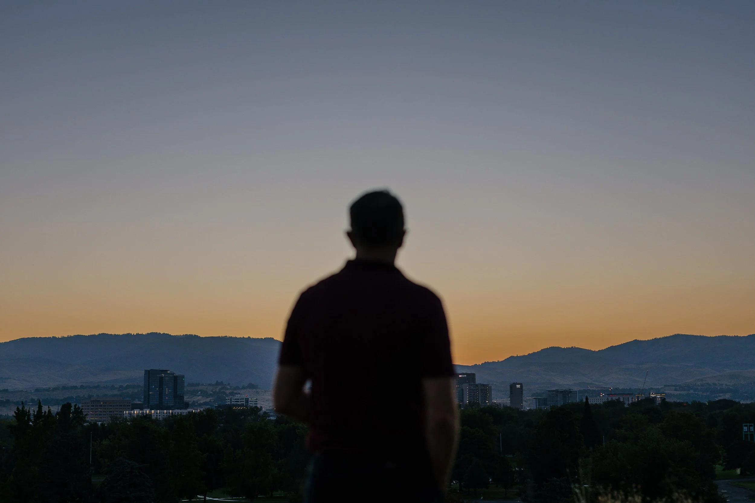 Boise counselor looking out over downtown Boise during a branding photo session.