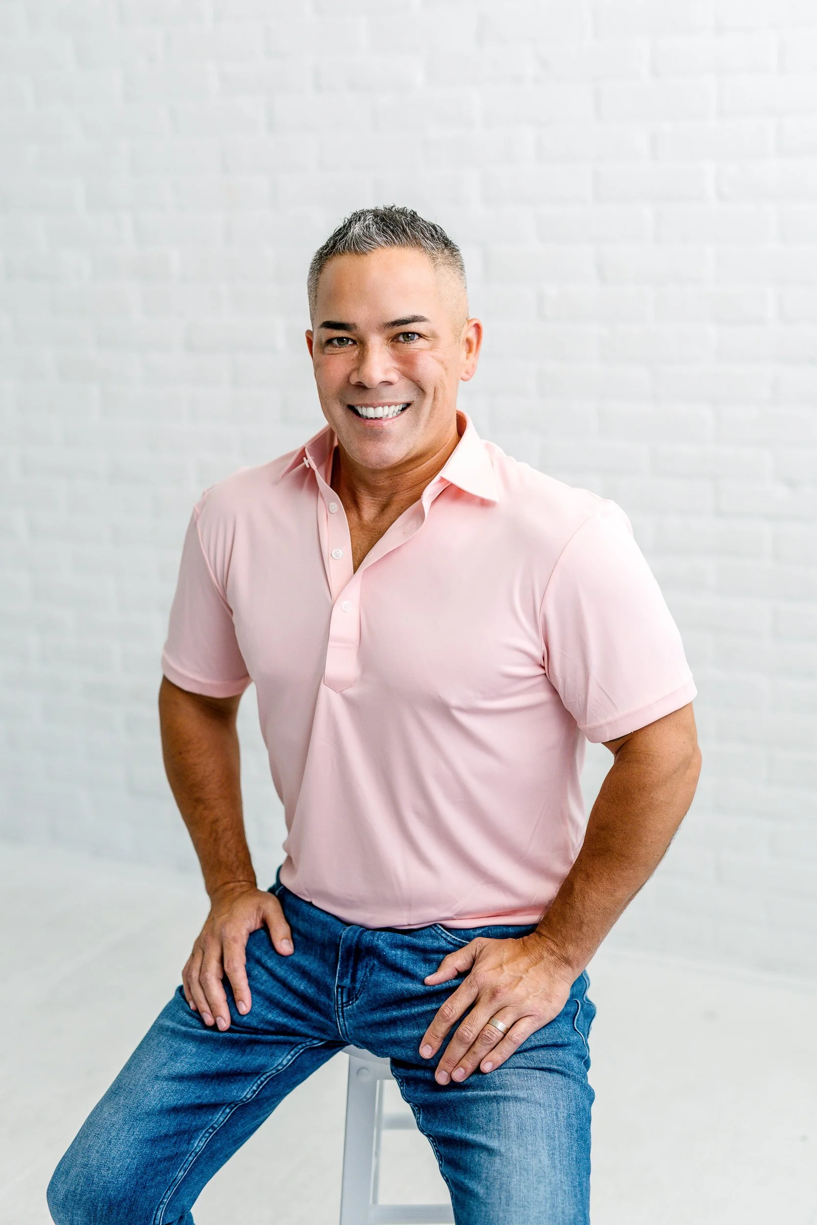 Entrepreneur smiling in a studio in downtown Boise during a branding photography session.