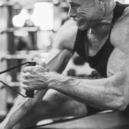 Indoor branding photography session showing a business owner photographed working out in a gym in Boise, Idaho.