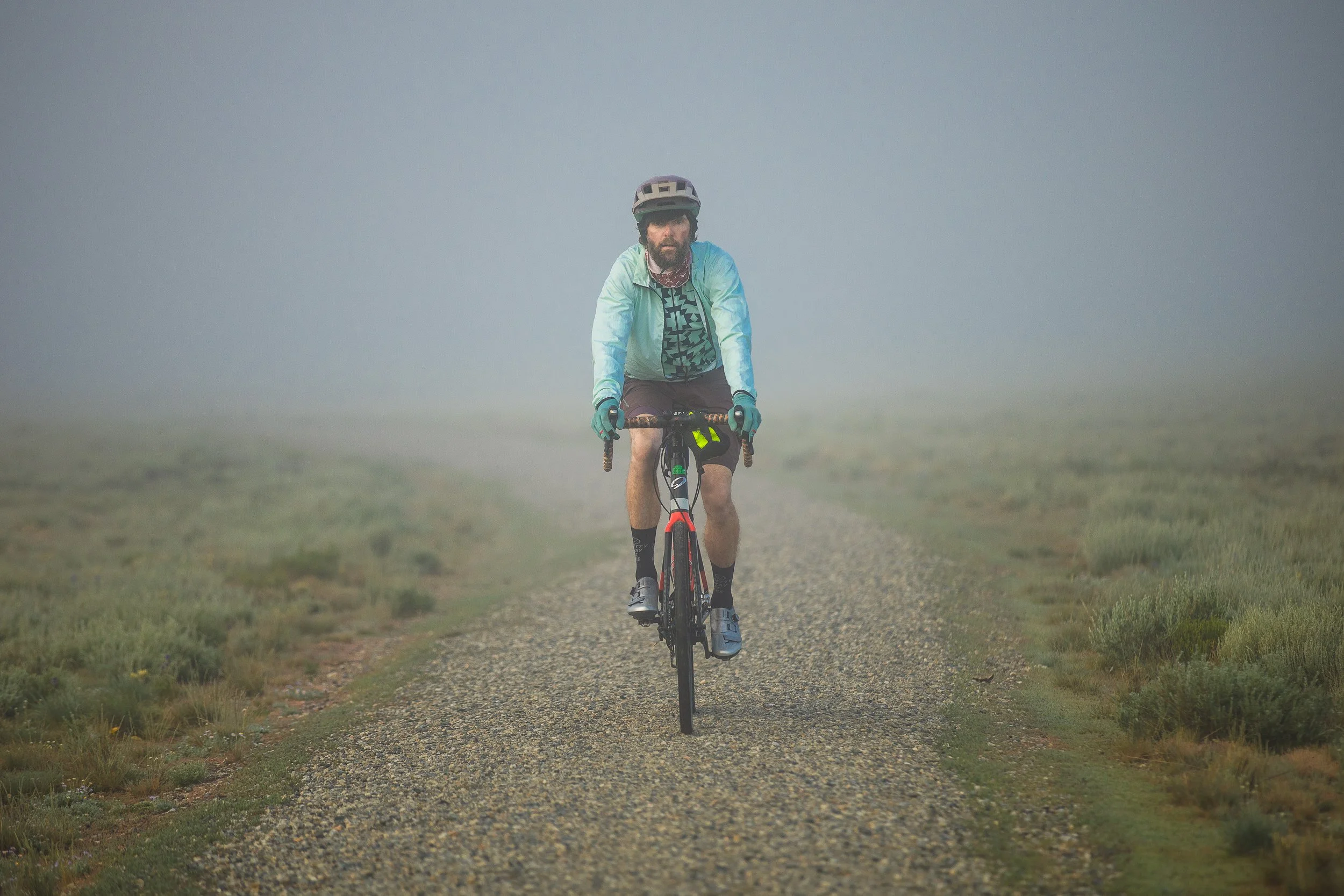 Man gravel biking in Stanley Idaho during a branding photo session.