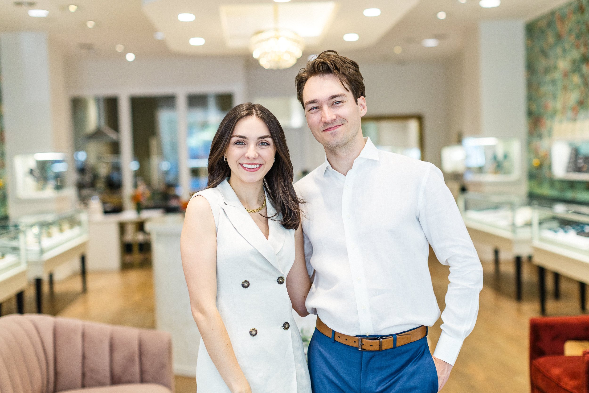Lifestyle branding photo of two business owners smiling in a custom jewelry shop during a branding photoshoot in downtown Boise.