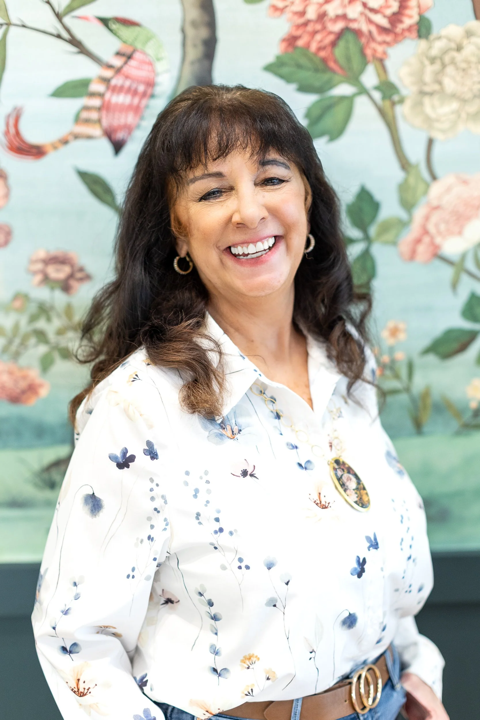 Lifestyle branding photo of an employee smiling in a custom jewelry shop during a branding photoshoot in downtown Boise.