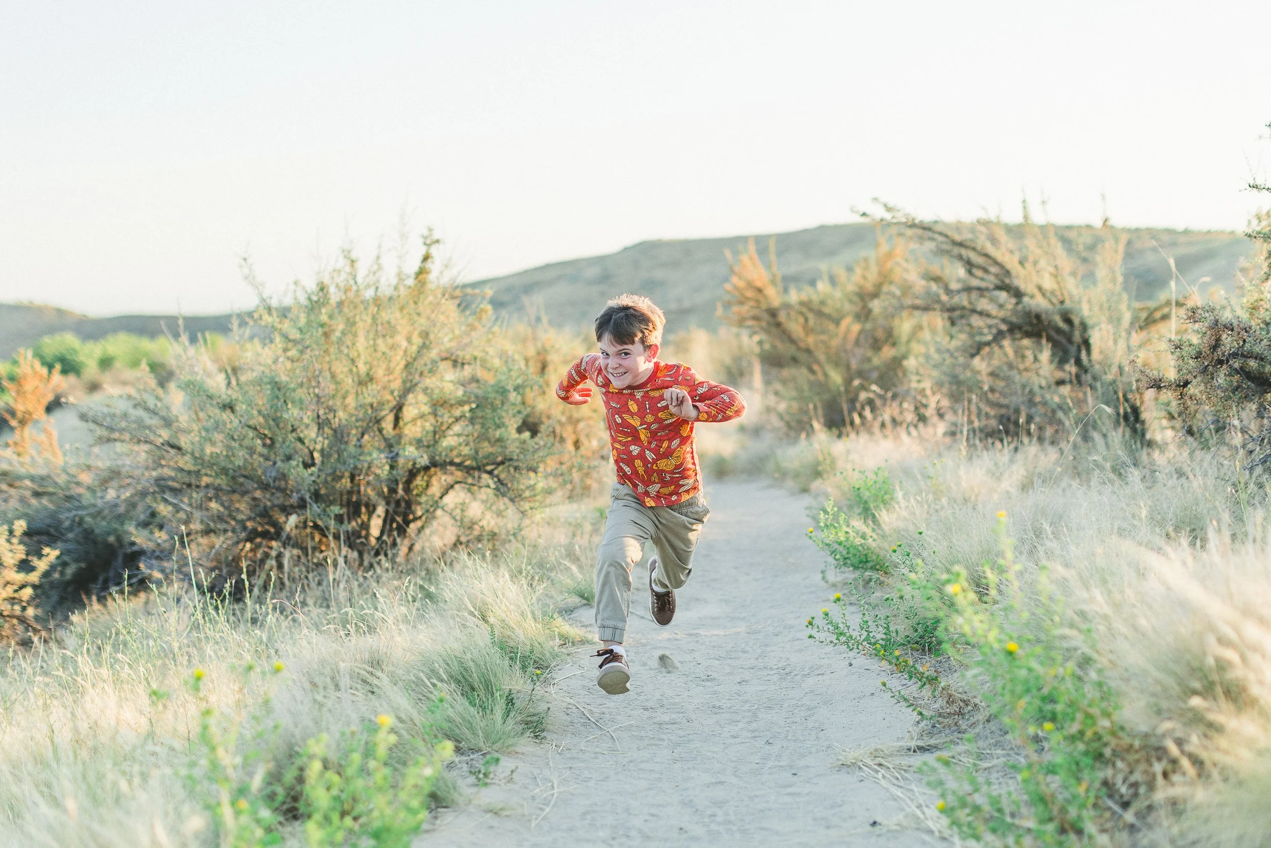 Lifestyle branding photo of a model wearing custom children’s clothing for a Boise brand photographed in the Boise foothills.