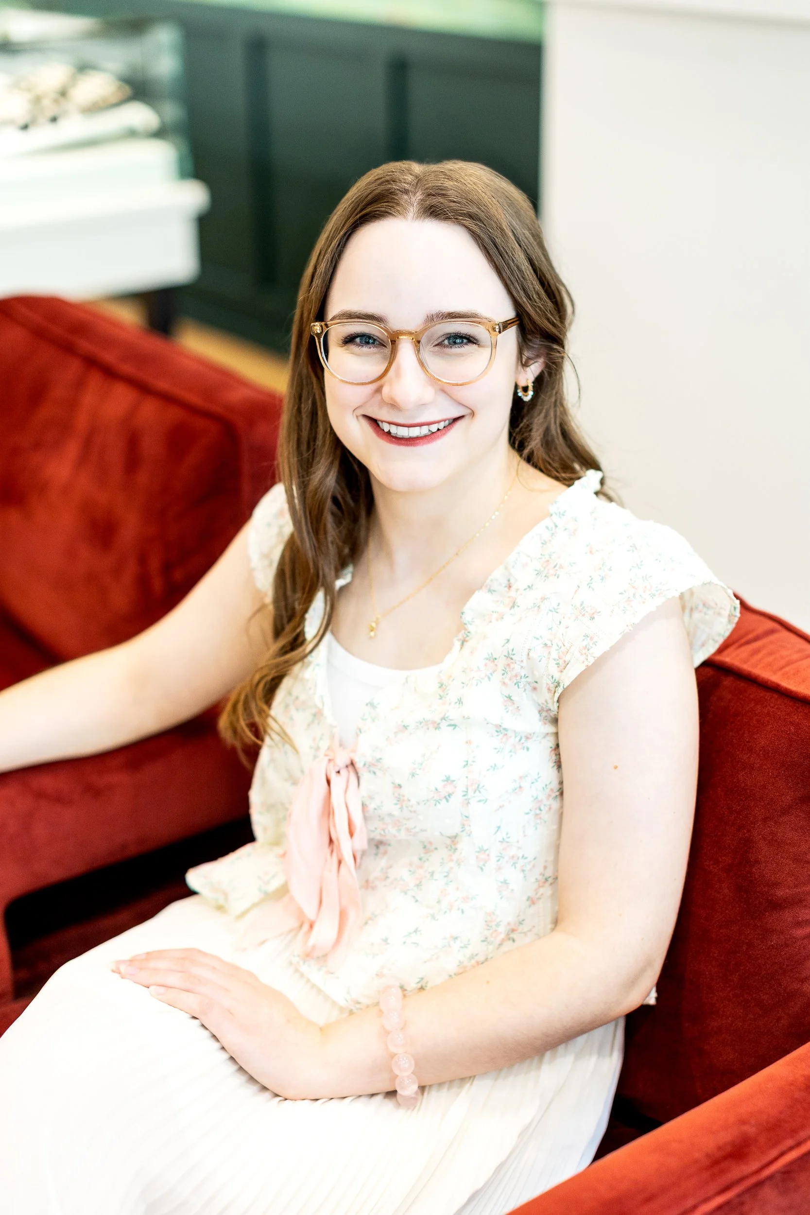 Lifestyle branding photo of an employee smiling in a custom jewelry shop during a branding photoshoot in downtown Boise.