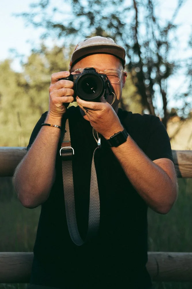 Behind-the-scenes photo of Boise branding photographer Bryan Rupp working during a personal brand photography session.