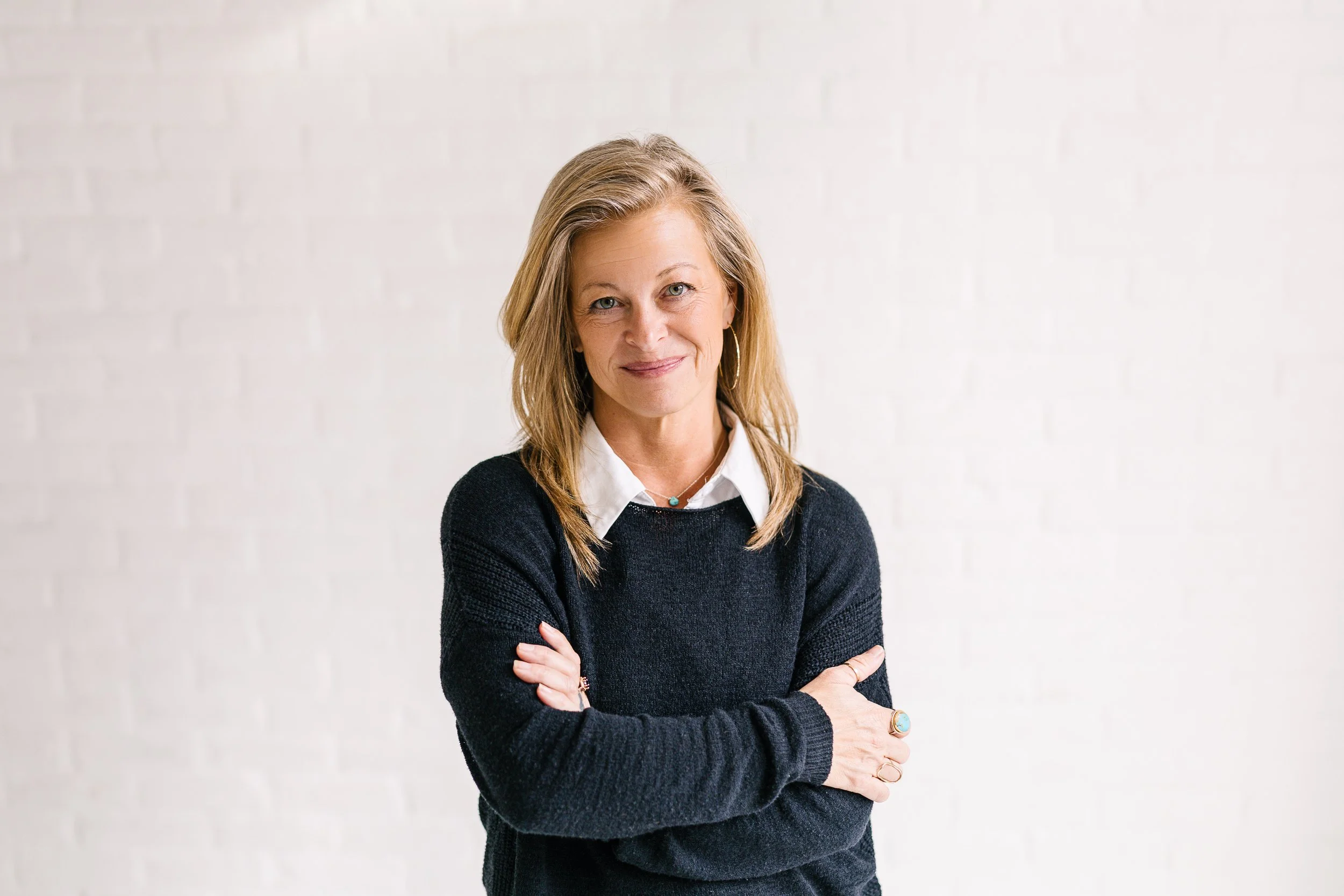Boise branding photographer branding session with a woman keynote speaker looking serious in a studio in downtown boise.
