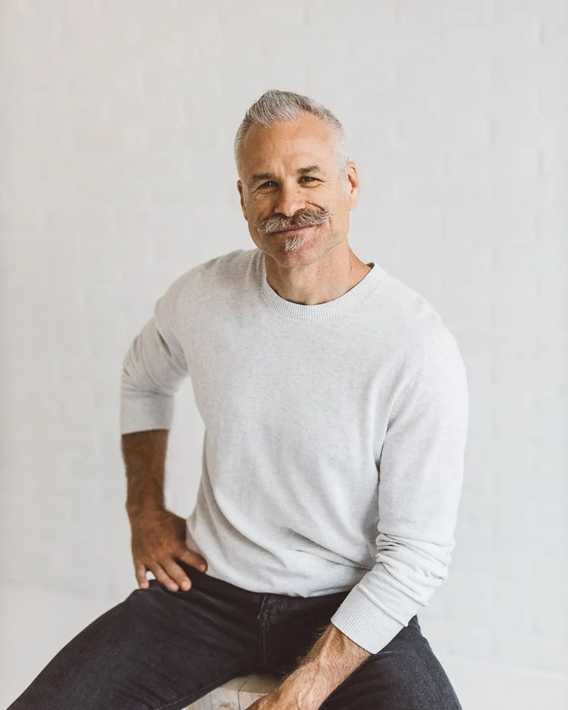 Branding photography portrait of a business owner in a Boise studio.