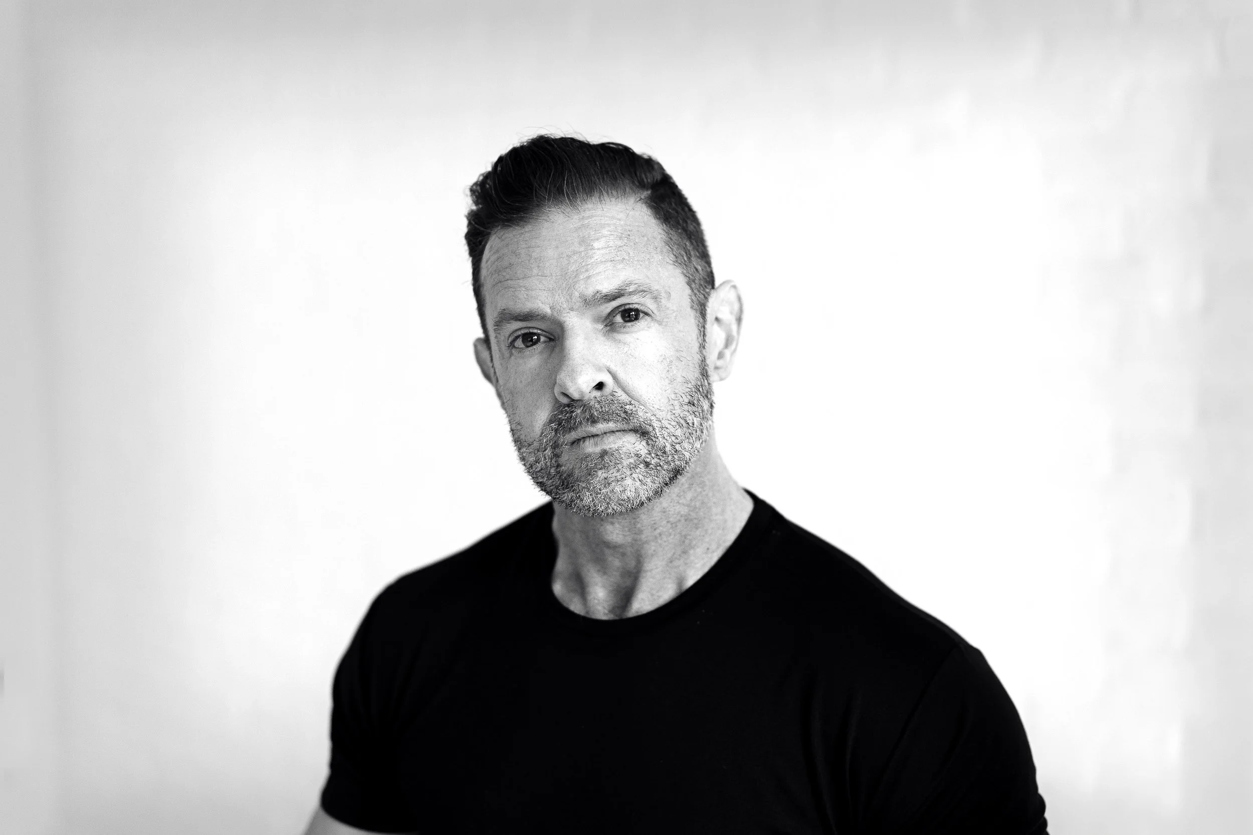 Boise branding photographer photographing an entrepreneur during a studio branding photoshoot in down Boise.