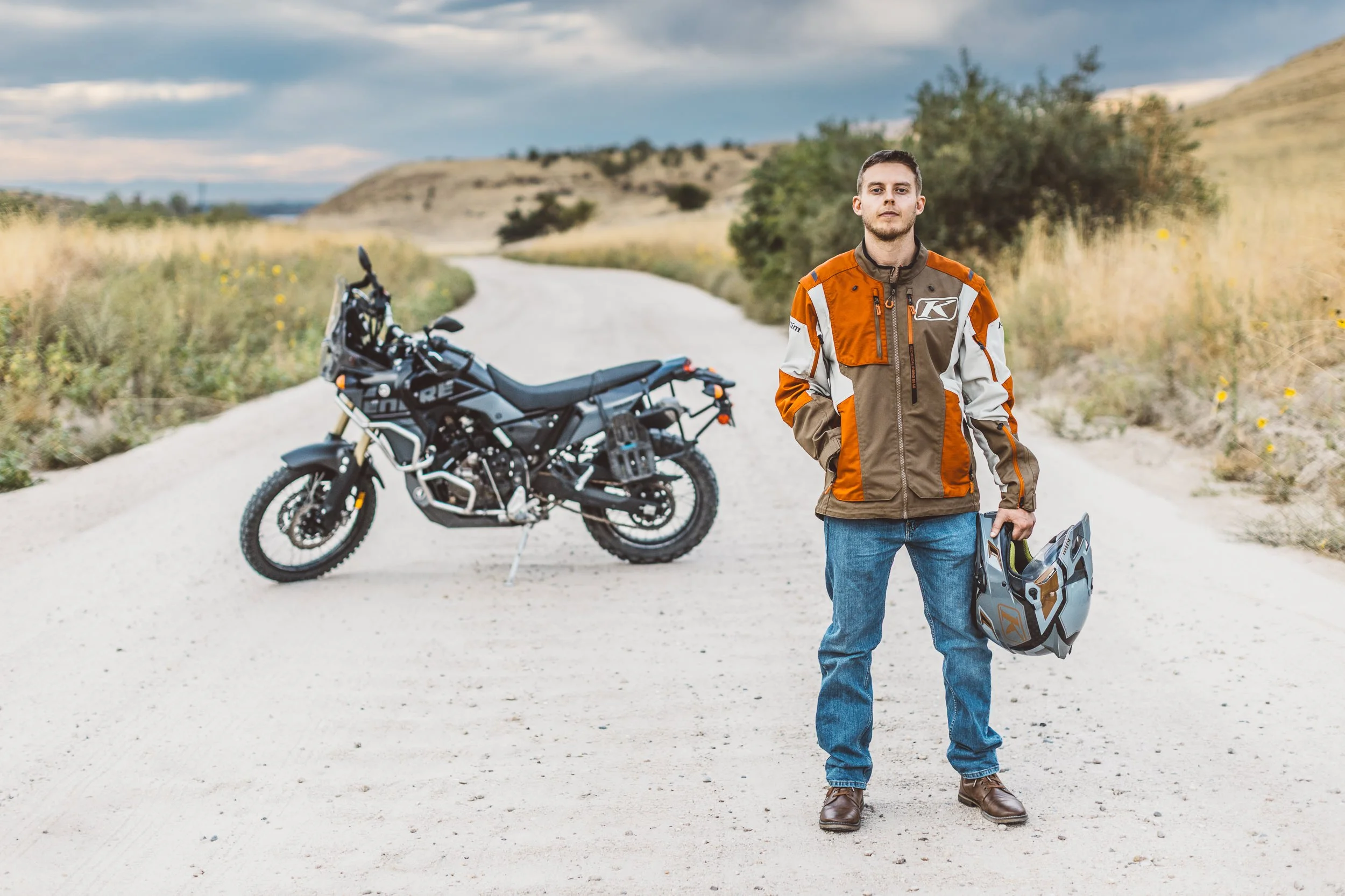 Adventure-focused personal branding photography of an entrepreneur with his motorcycle in the Boise Foothills showcasing a self-improvement driven entrepreneur