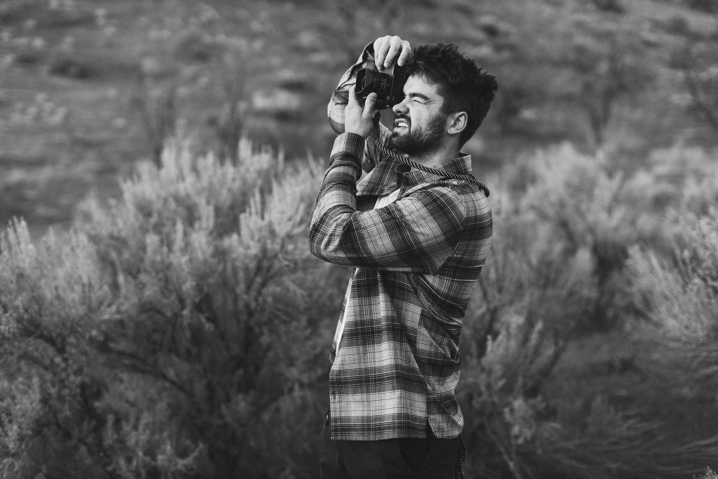 Boise branding photographer capturing lifestyle portraits of a media producer in the Boise foothills